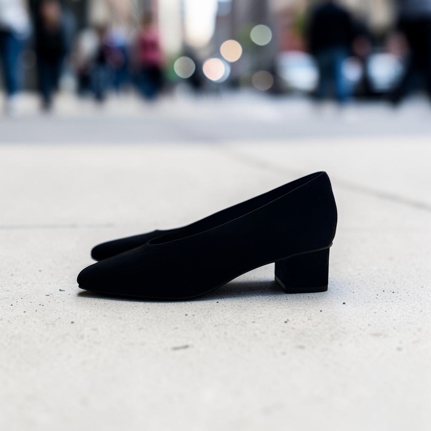 Plum Bottom VANELI Solara black suede pump with a square toe and low block heel, side profile view.