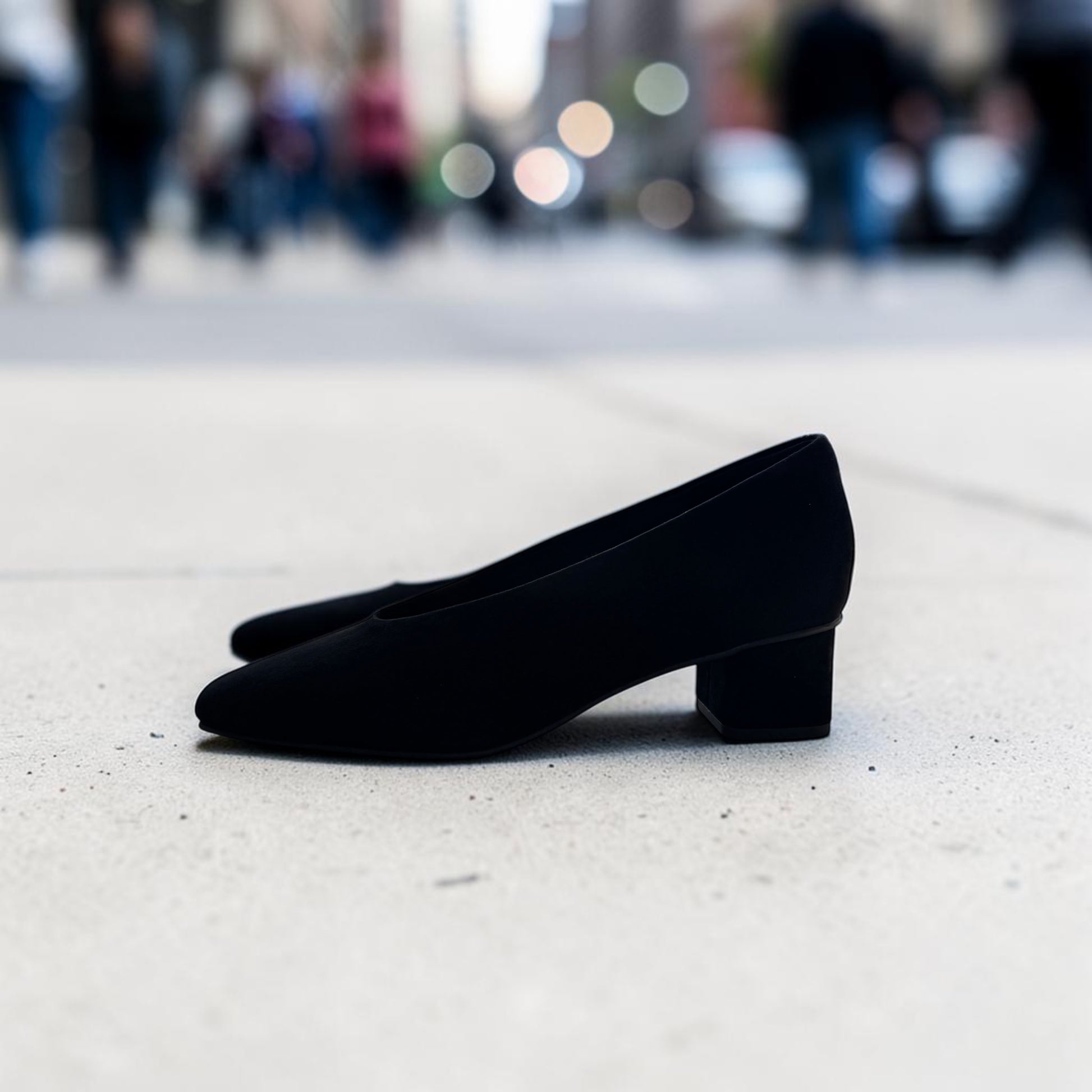Plum Bottom VANELI Solara black suede pump with a square toe and low block heel, side profile view.