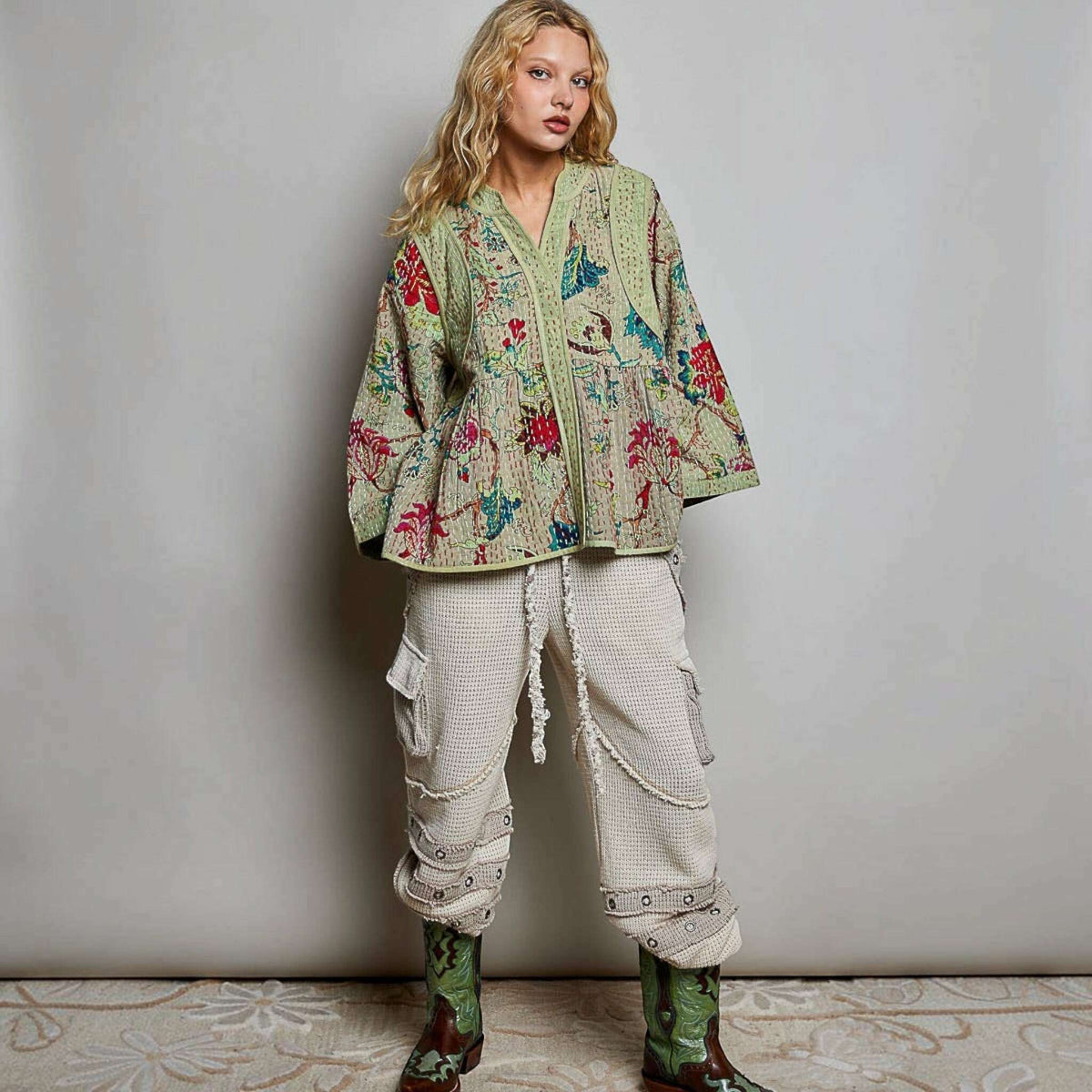 Plum Bottom Pol Clothing quilted floral kimono-style top in powder olive with hand-stitch detail and wide sleeves.