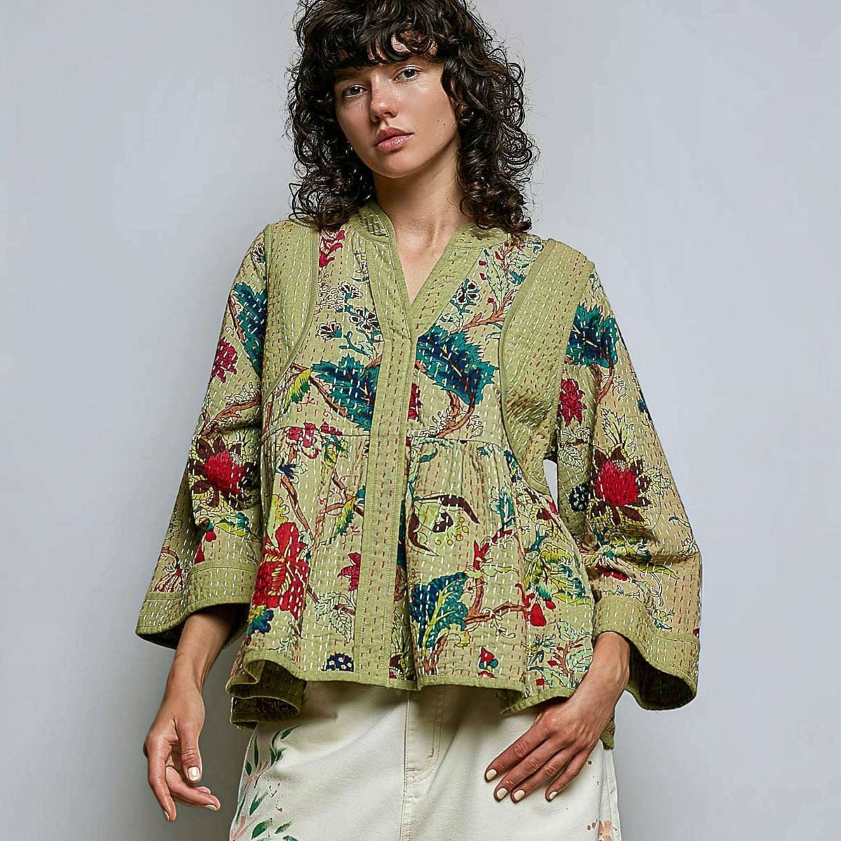 Plum Bottom Pol Clothing quilted floral kimono-style top in powder olive with contrast hand-stitch detailing.