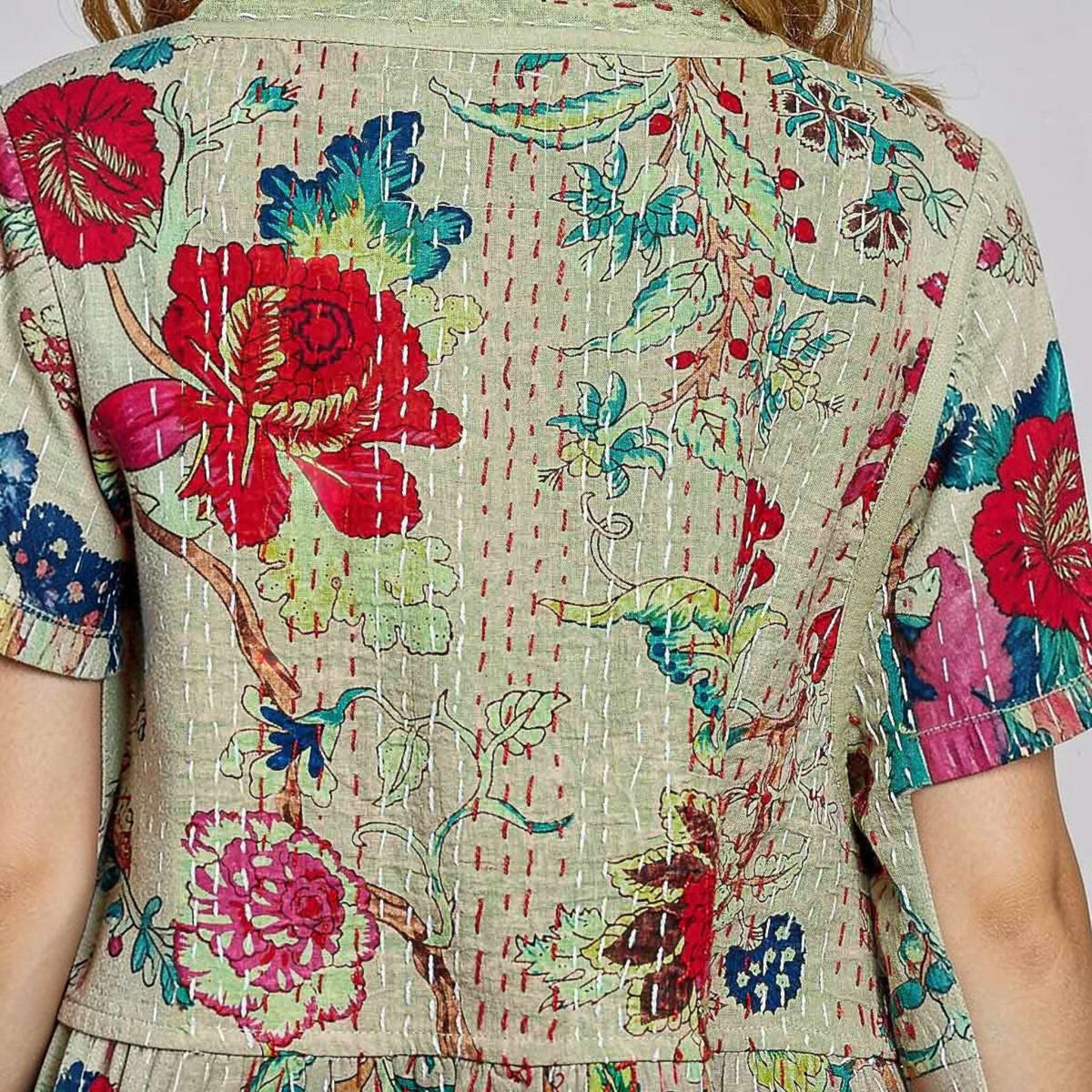 Plum Bottom Pol Clothing quilted kimono-style top in powder olive with vibrant floral print and contrast hand-stitching