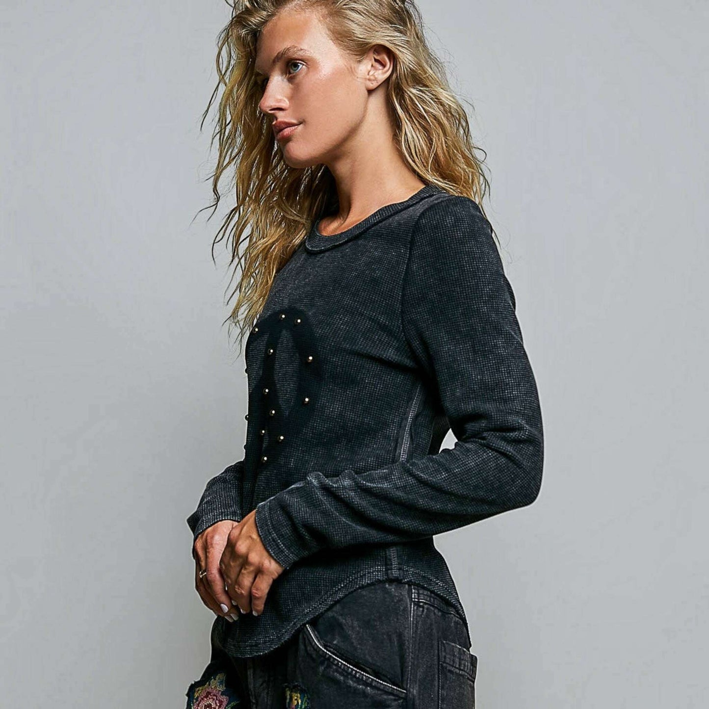 Plum Bottom POL CLOTHING vintage wash thermal knit top with peace sign studs and outseam detail on a model