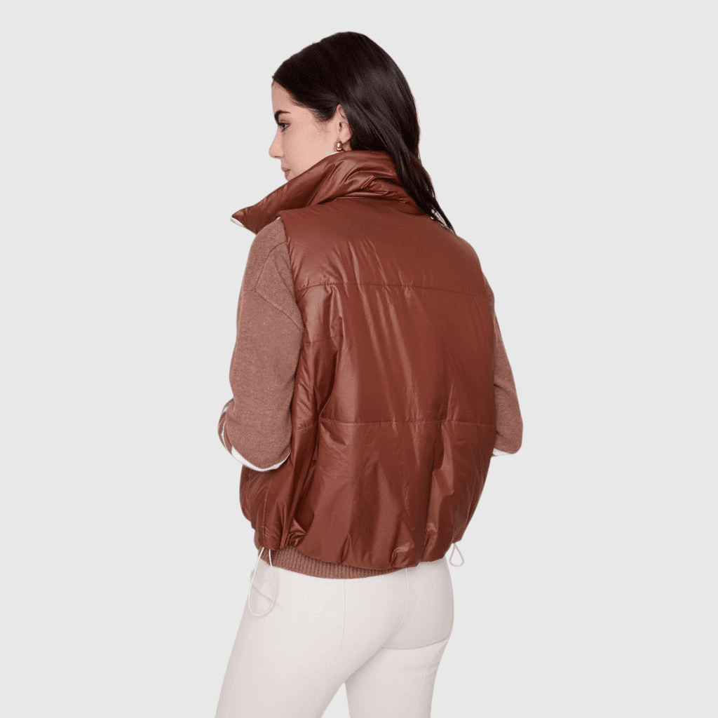 Plum Bottom RENUAR reversible brown cropped puffer vest worn over a matching brown sweater on a model
