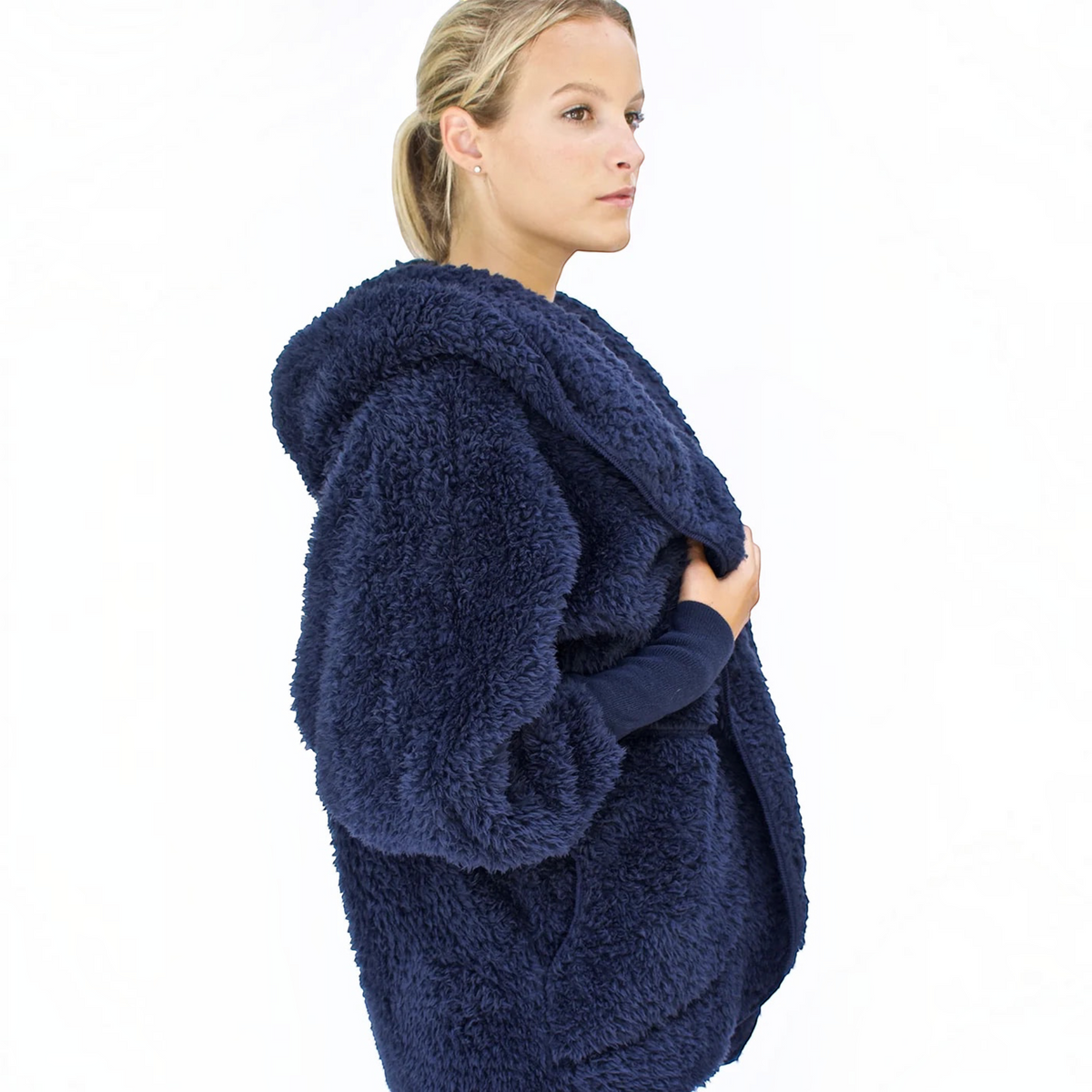 Plum Bottom NORDIC BEACH navy blue hooded body wrap in fluffy micro poly fabric worn by a woman