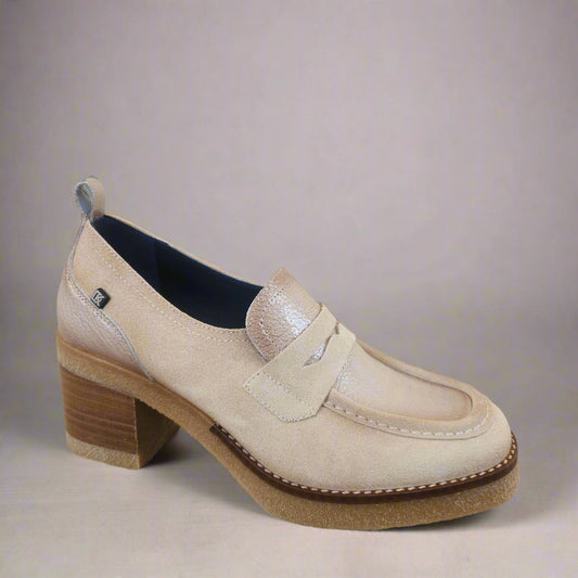 Beige loafer shoe on a mannequin against a neutral background