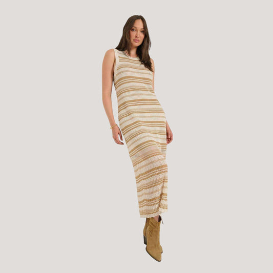 Plum Bottom Seventy Eight and Sunny Ruby crochet midi dress with sheer pointelle stripes and tan suede boots.