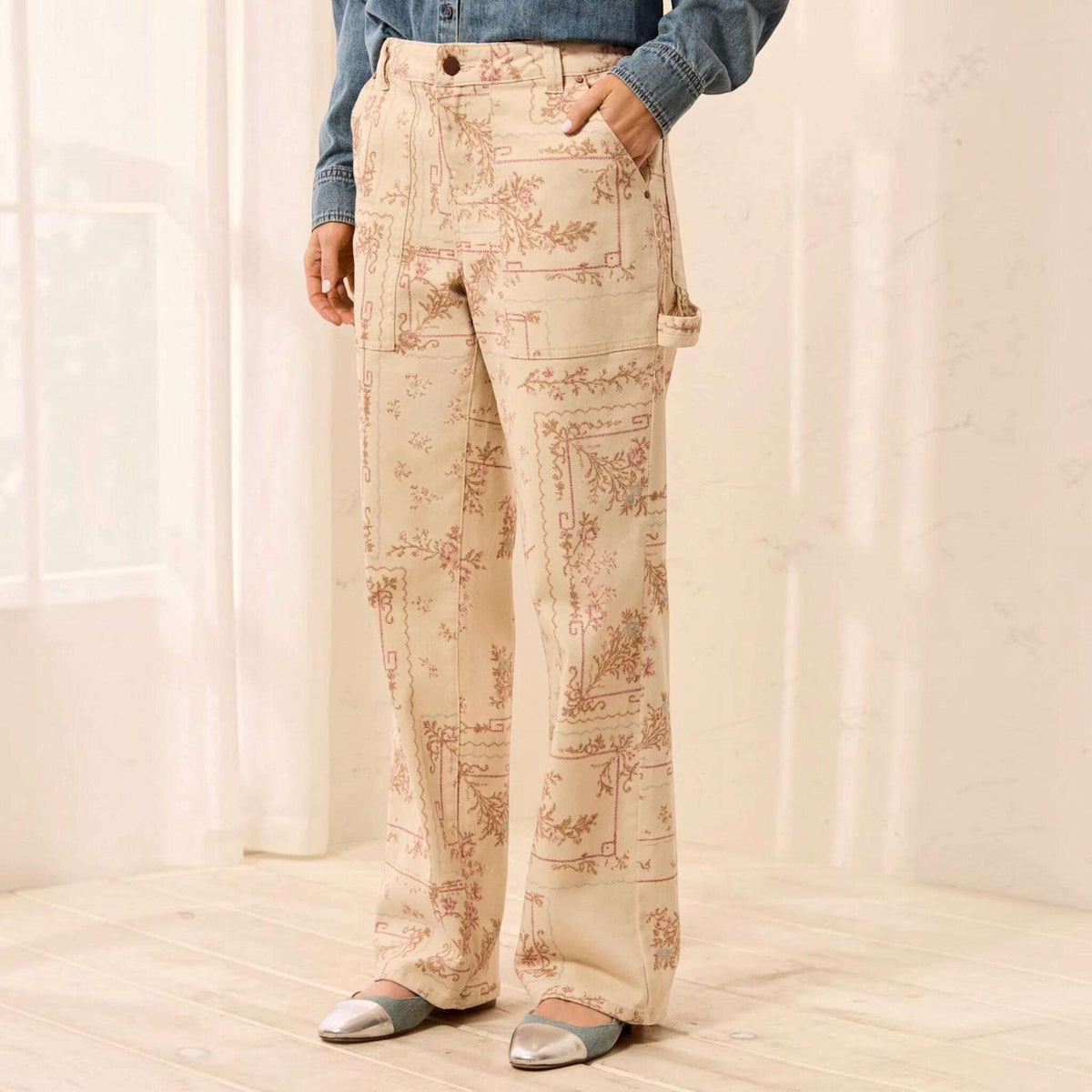 Plum Bottom TRIBAL Audrey carpenter pants in cream with a vintage-style floral print and utility pocket details.