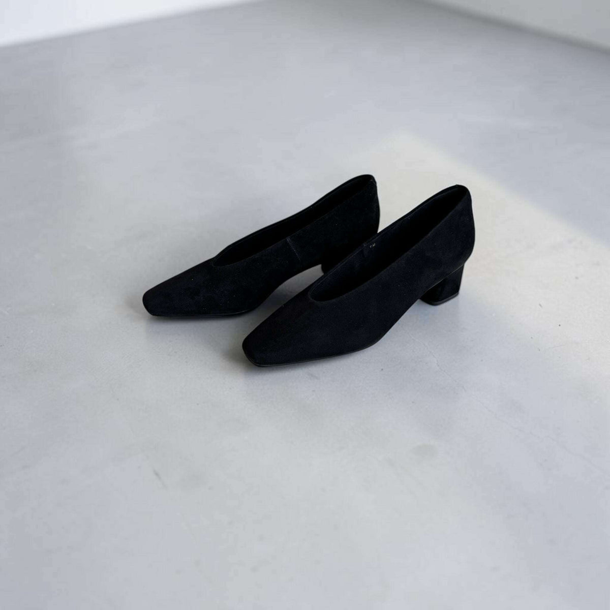 Plum Bottom VANELI Solara black suede pumps with a modern square toe and comfortable low block heel.