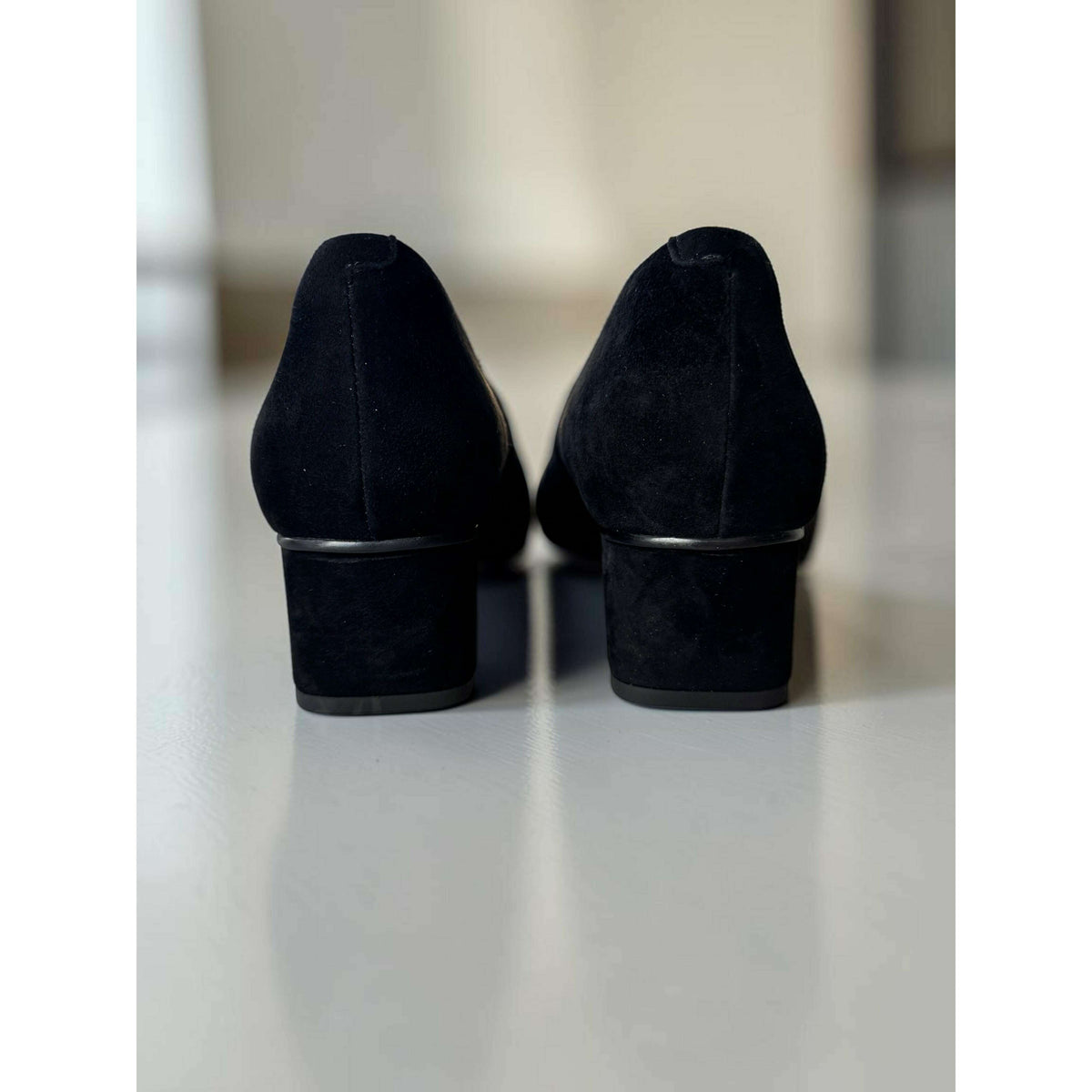Plum Bottom VANELI Solara black suede block heel pumps viewed from the back showing the refined silhouette