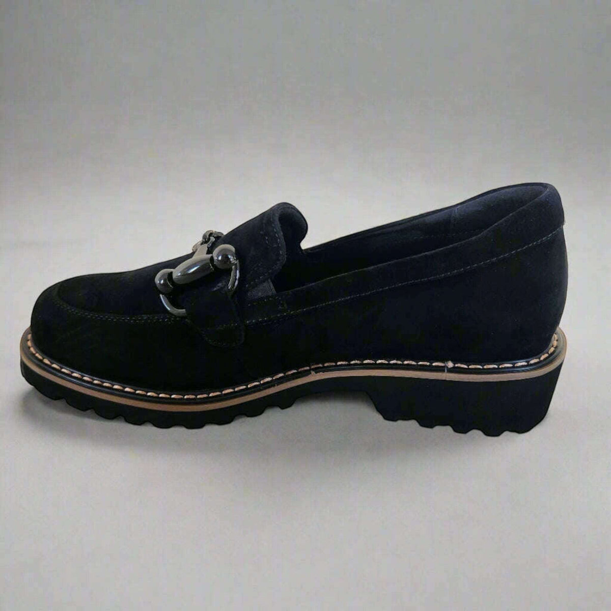 Plum Bottom VANELI Zimmy black suede loafer with shiny metal bit, lug sole, and tan welt stitching side view